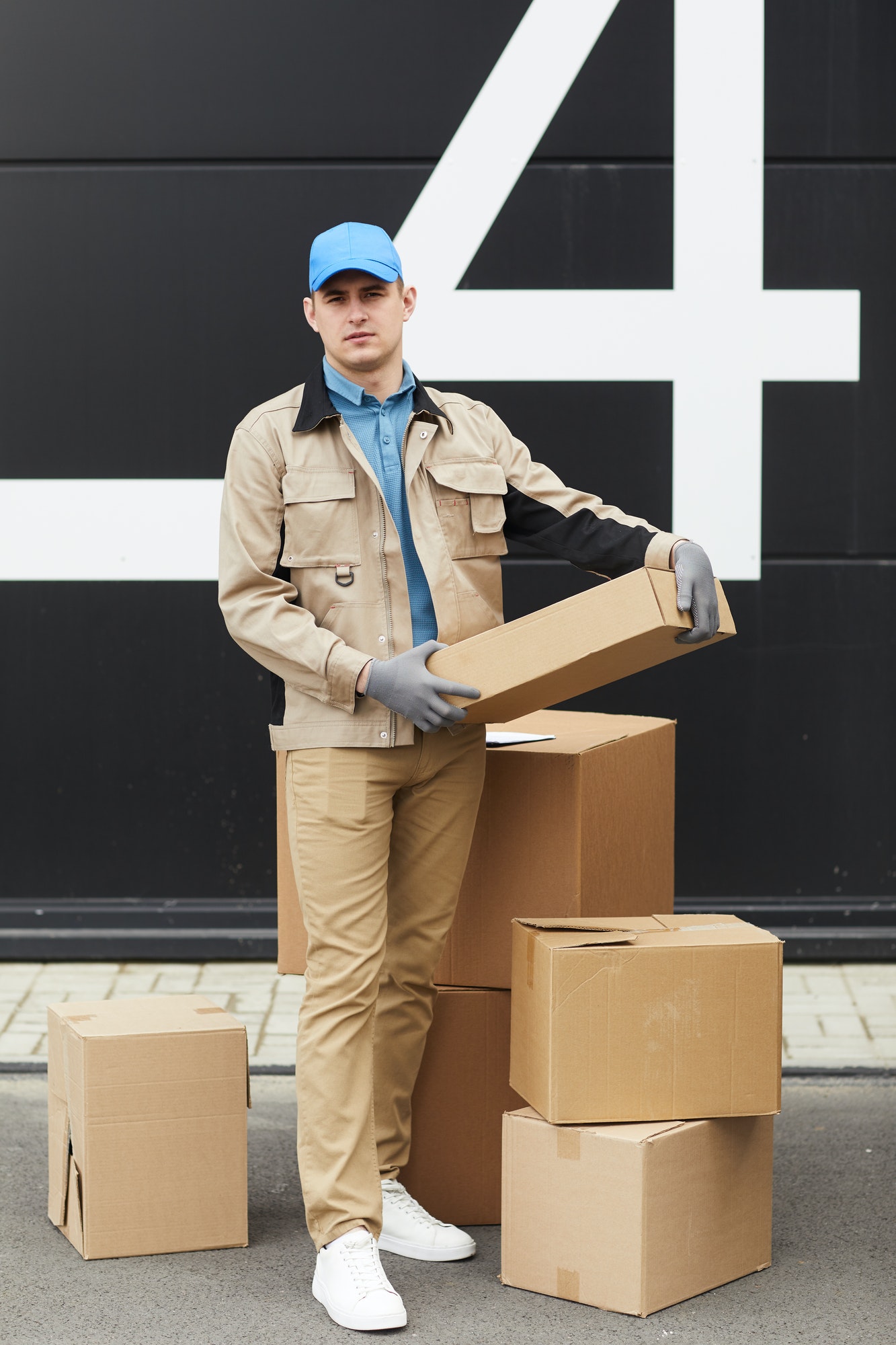 courier-working-with-parcels-in-warehouse.jpg